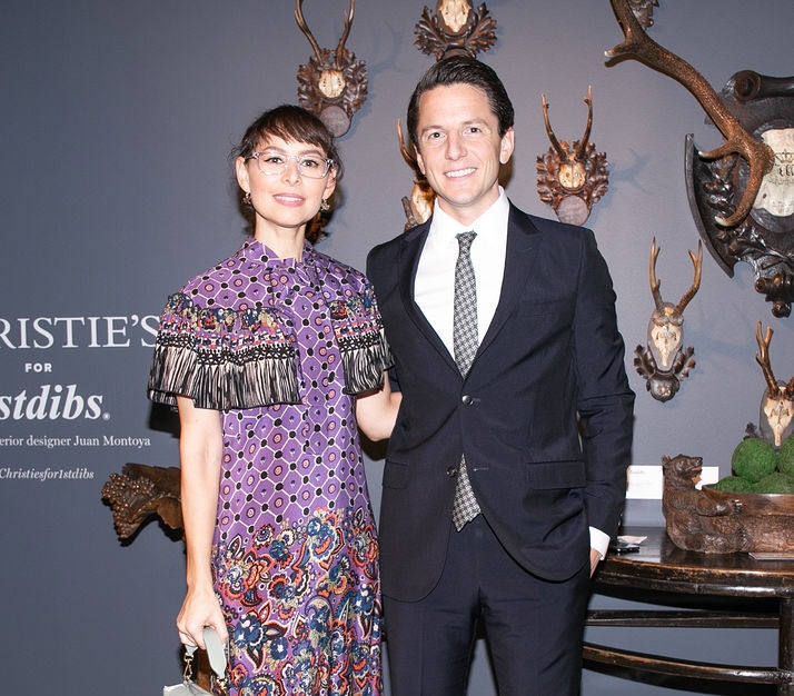 Matt and Christina stand next to other at a Christie's for 1stdibs event